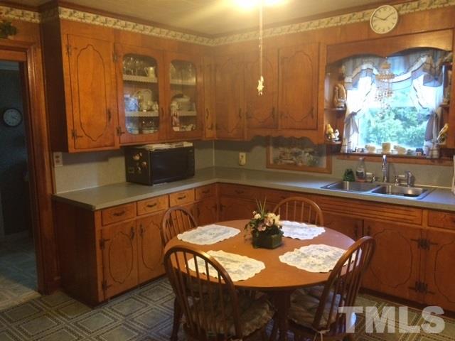 419 Edgar Street Roxboro, NC 27573 - Photo 15 of 18 a kitchen with a sink and a cabinets