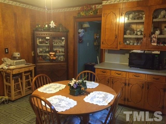 419 Edgar Street Roxboro, NC 27573 - Photo 16 of 18 a view of a dining room with furniture and chandelier