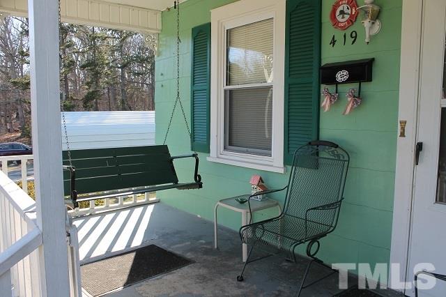 419 Edgar Street Roxboro, NC 27573 - Photo 3 of 18 a view of a door and chair in the balcony