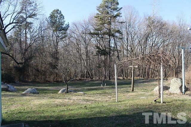 419 Edgar Street Roxboro, NC 27573 - Photo 4 of 18 a backyard of a house with lots of green space