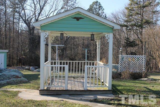 419 Edgar Street Roxboro, NC 27573 - Photo 9 of 18 a view of a wooden deck with a yard