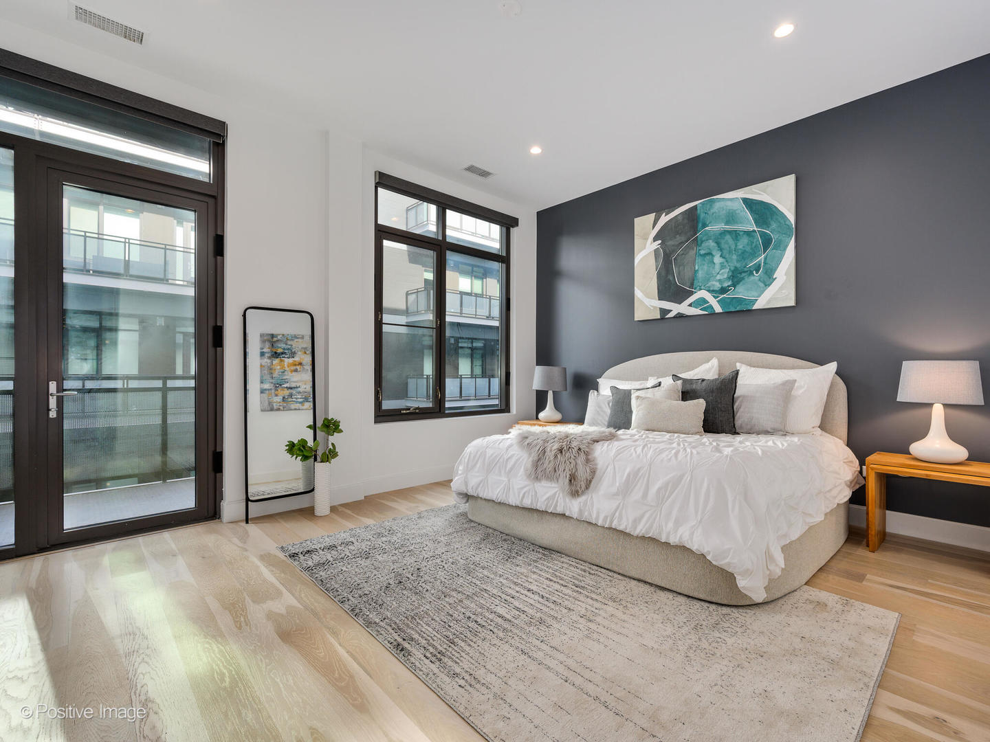 39 North Aberdeen Street, Unit 4S Chicago, IL 60607 - Photo 16 of 25 a spacious bedroom with a large bed and a large window