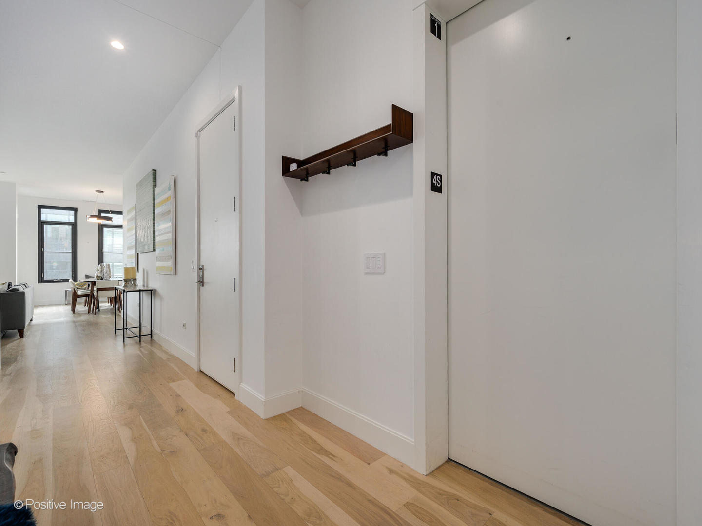 39 North Aberdeen Street, Unit 4S Chicago, IL 60607 - Photo 2 of 25 wooden floor in a hall with an entryway