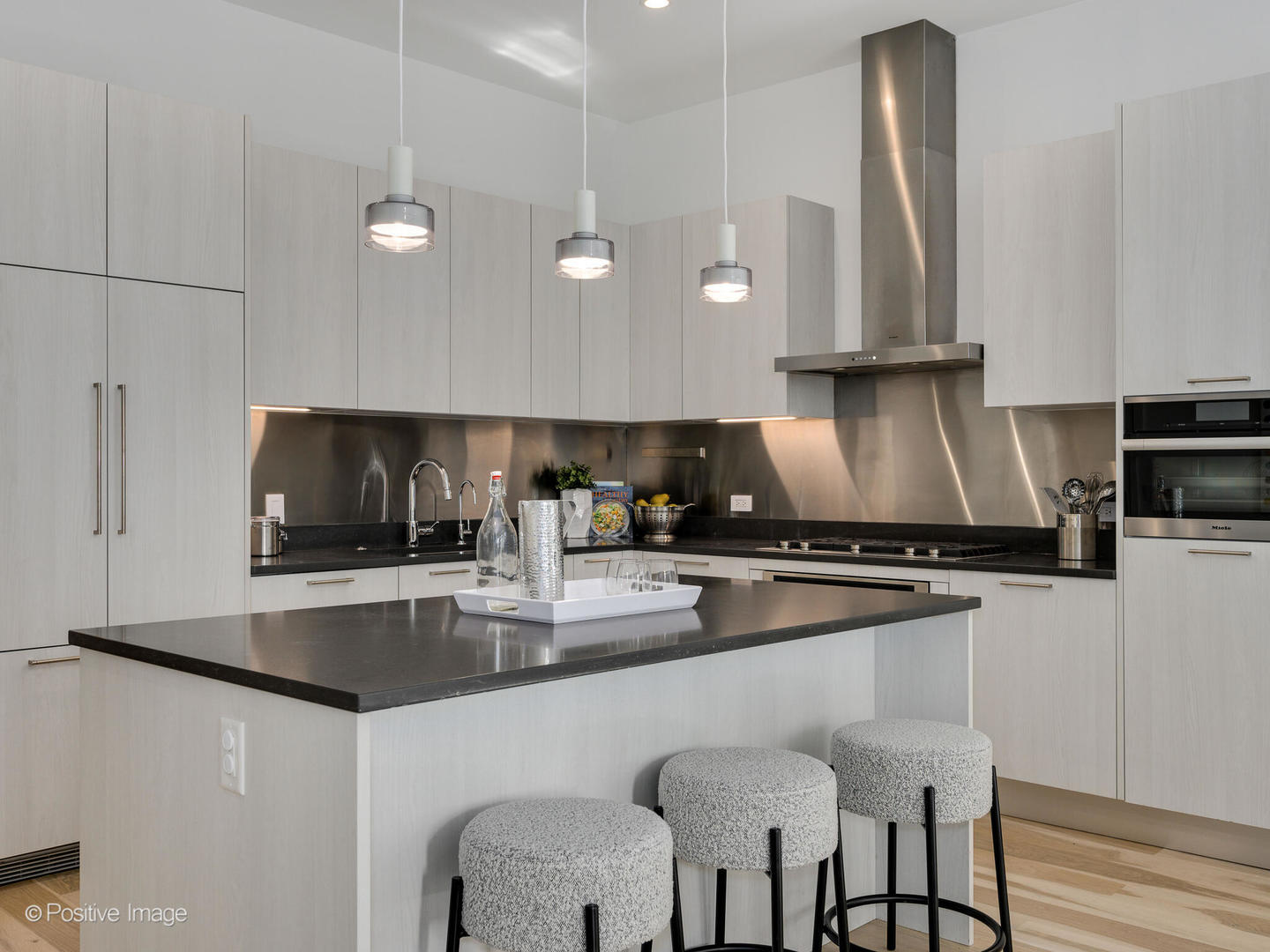 39 North Aberdeen Street, Unit 4S Chicago, IL 60607 - Photo 5 of 25 a kitchen with stainless steel appliances granite countertop a sink a stove and a refrigerator