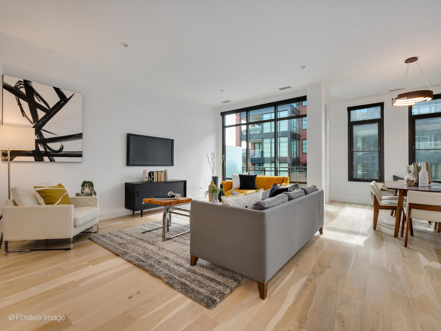 39 North Aberdeen Street, Unit 4S Chicago, IL 60607 - Photo 8 of 25 a living room with furniture and a flat screen tv