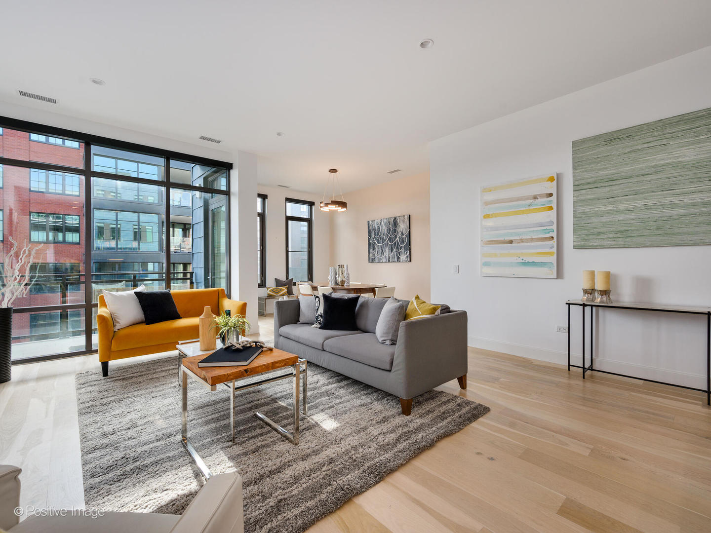 39 North Aberdeen Street, Unit 4S Chicago, IL 60607 - Photo 10 of 25 a living room with furniture and a large window