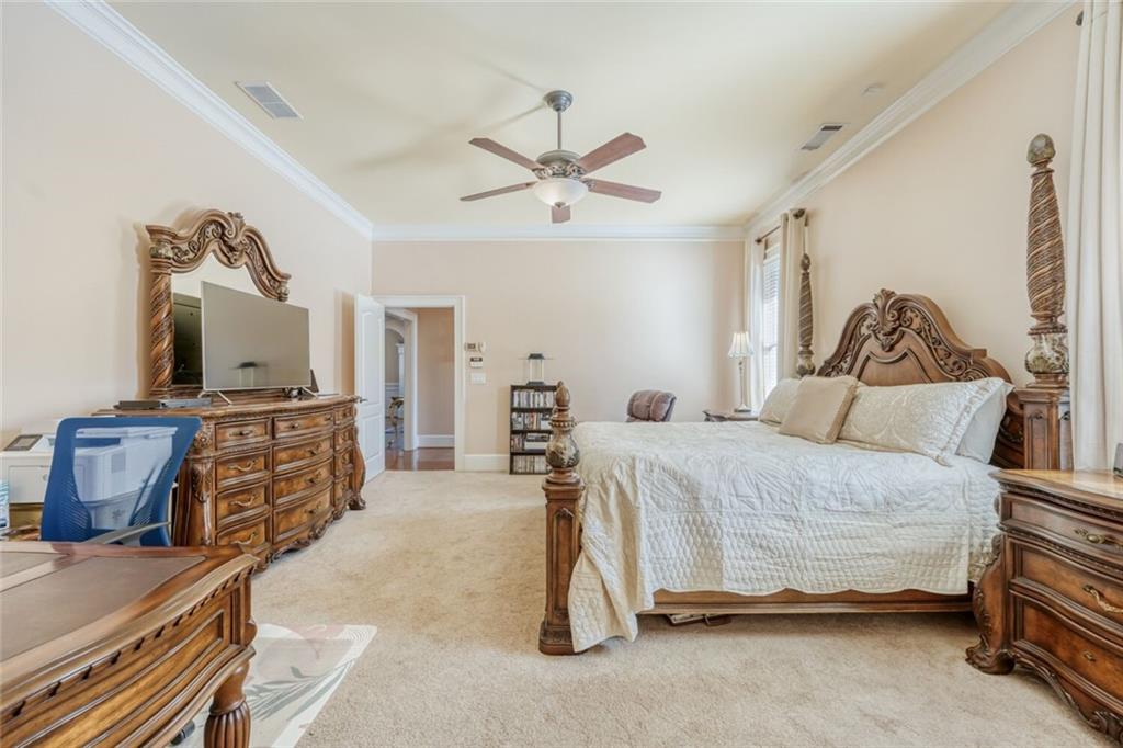 2380 Muskogee Lane Braselton, GA 30517 - Photo 22 of 30 a bedroom with a bed and wooden floor