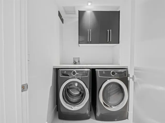 a outdoor patio with swimming pool table and chairs