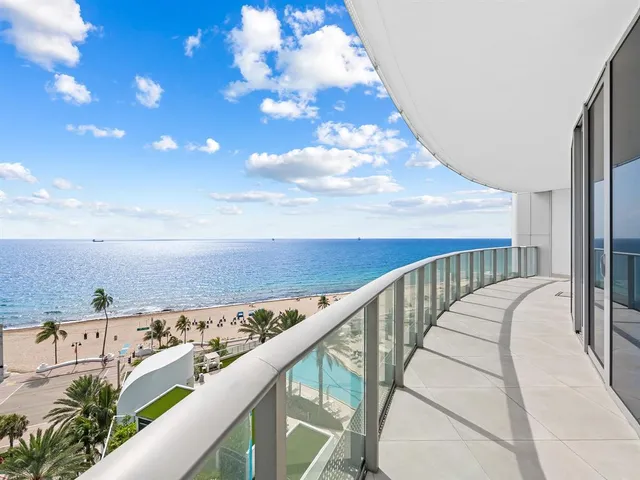 a view of a balcony with an ocean view
