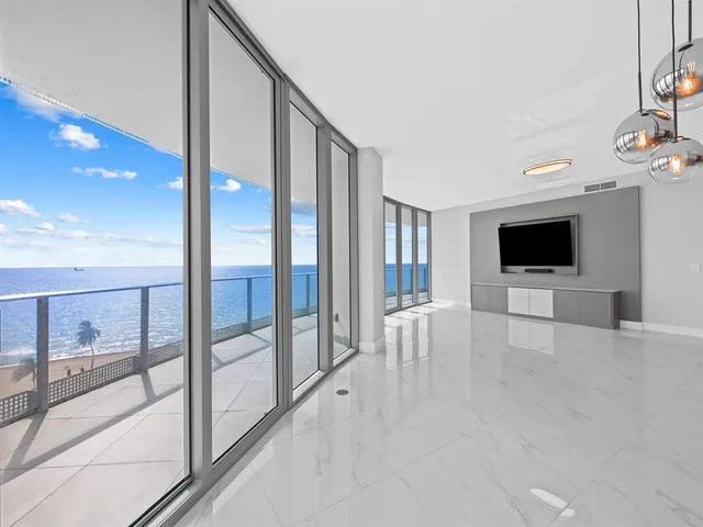 wooden floor with an empty room and fire place