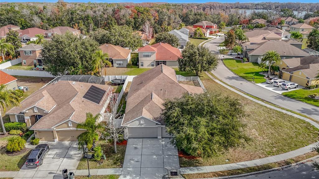 8942 Sandusky Lane New Port Richey, FL 34654 - Photo 2 of 87 an aerial view of a house with a garden and lake view