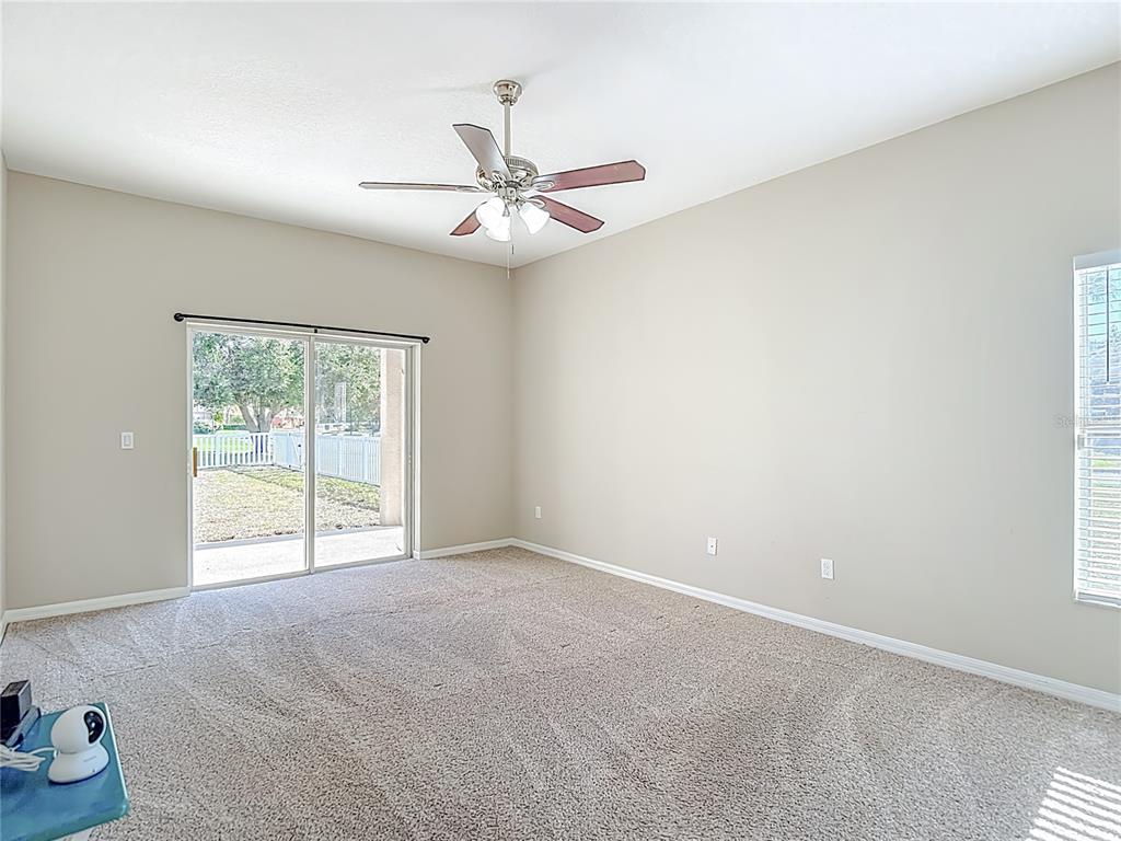 8942 Sandusky Lane New Port Richey, FL 34654 - Photo 37 of 87 an empty room with windows and fan