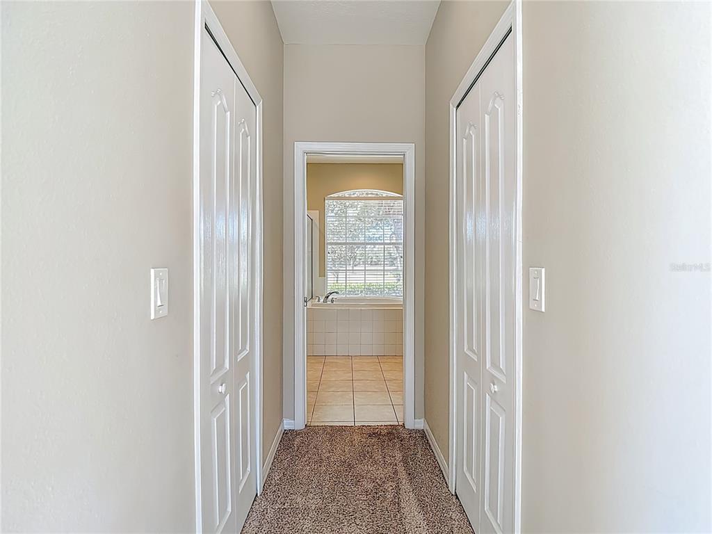 8942 Sandusky Lane New Port Richey, FL 34654 - Photo 42 of 87 a view of a hallway with a white walls