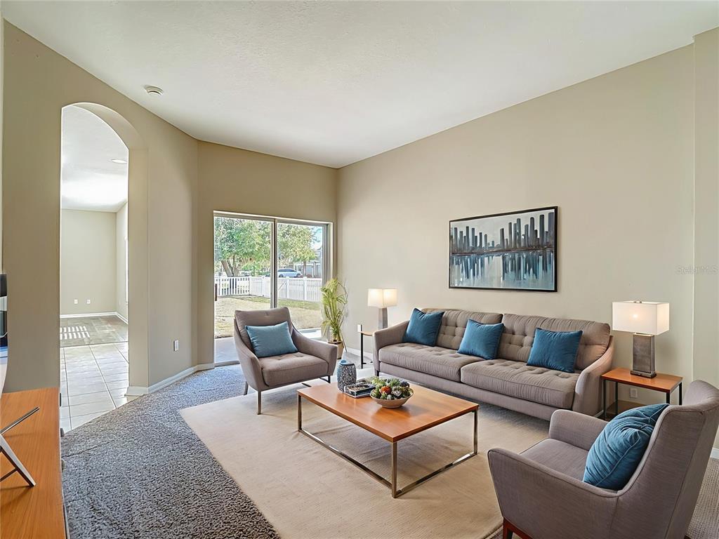 8942 Sandusky Lane New Port Richey, FL 34654 - Photo 5 of 87 a living room with furniture and a window
