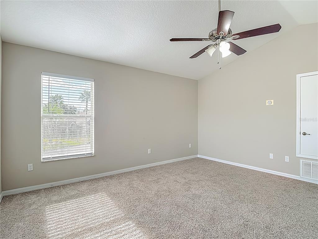 8942 Sandusky Lane New Port Richey, FL 34654 - Photo 51 of 87 an empty room with a window and a fan