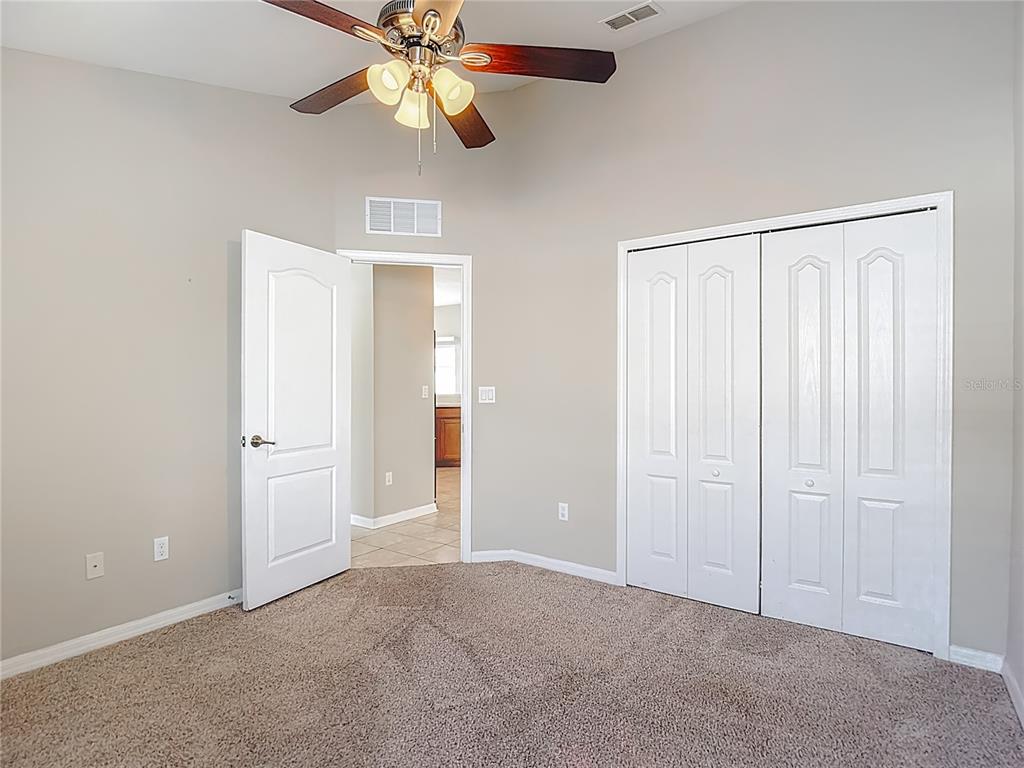 8942 Sandusky Lane New Port Richey, FL 34654 - Photo 57 of 87 an empty room with closet and a chandelier fan