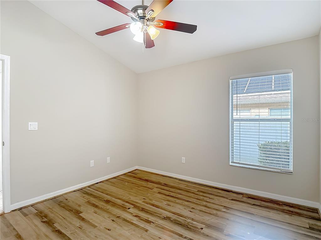 8942 Sandusky Lane New Port Richey, FL 34654 - Photo 60 of 87 wooden floor in an empty room with a window