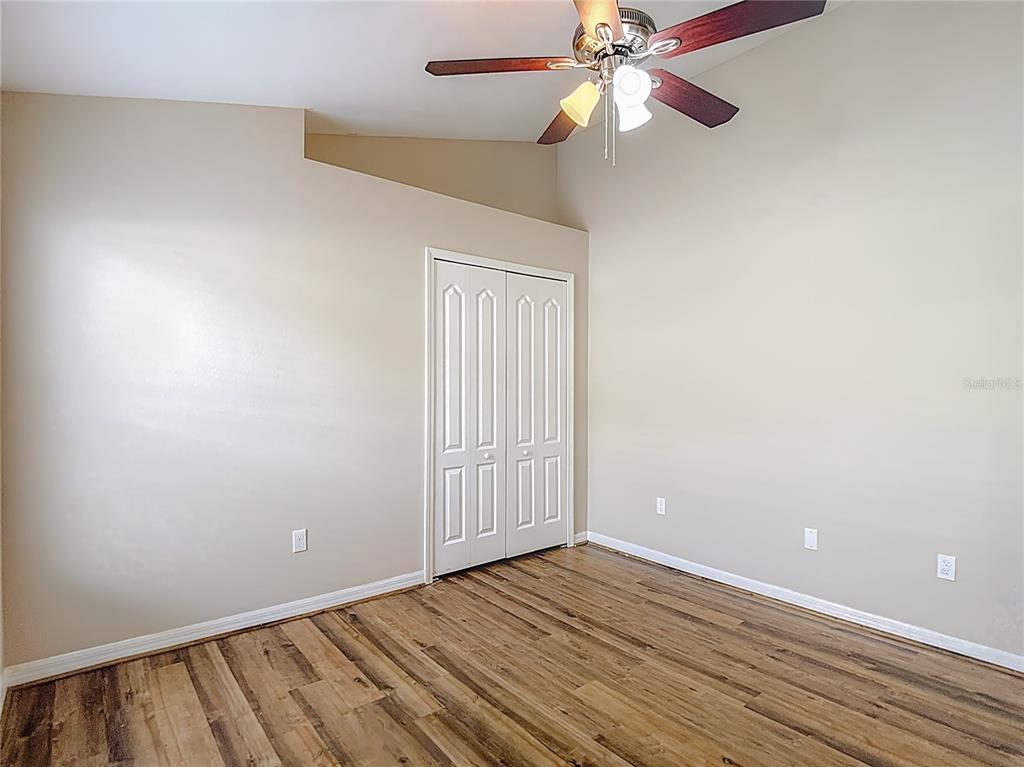 8942 Sandusky Lane New Port Richey, FL 34654 - Photo 62 of 87 wooden floor in an empty room with a window