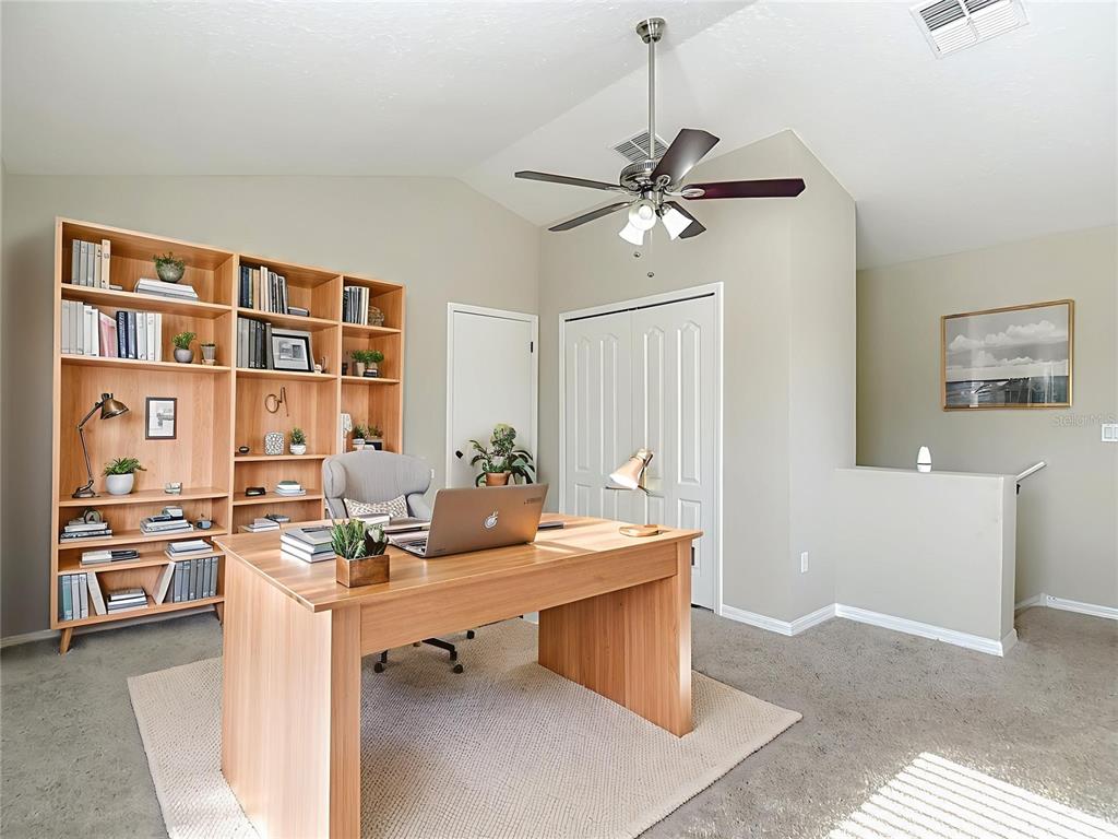 8942 Sandusky Lane New Port Richey, FL 34654 - Photo 7 of 87 a room with a couch and a ceiling fan