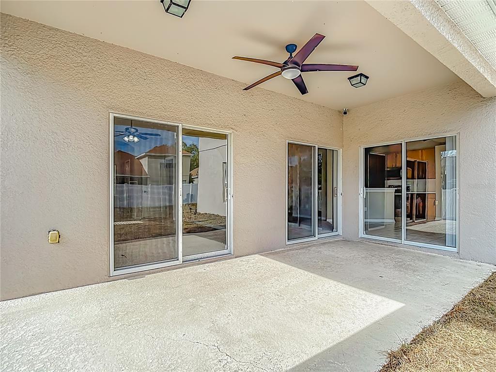 8942 Sandusky Lane New Port Richey, FL 34654 - Photo 71 of 87 a view of an empty room with a ceiling fan