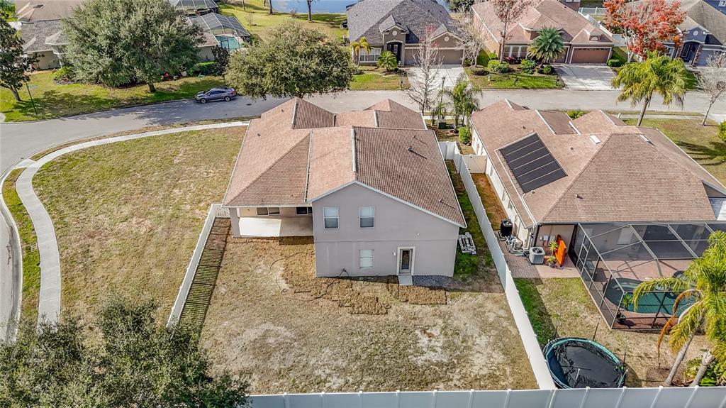 8942 Sandusky Lane New Port Richey, FL 34654 - Photo 74 of 87 an aerial view of a house with swimming pool and large trees