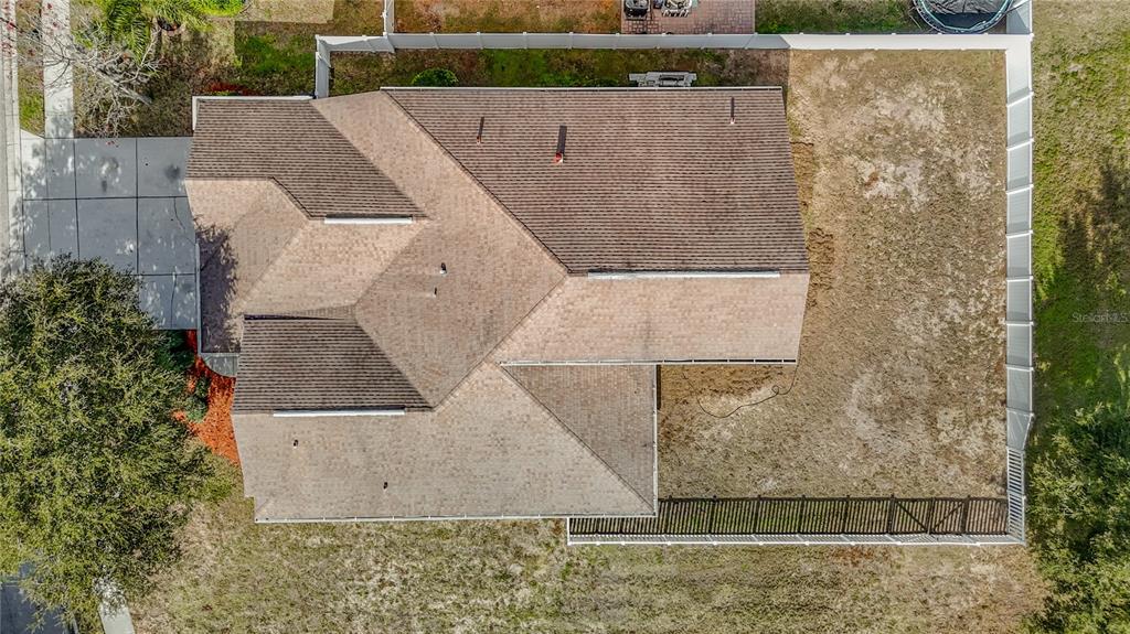 8942 Sandusky Lane New Port Richey, FL 34654 - Photo 76 of 87 an aerial view of a house with a yard
