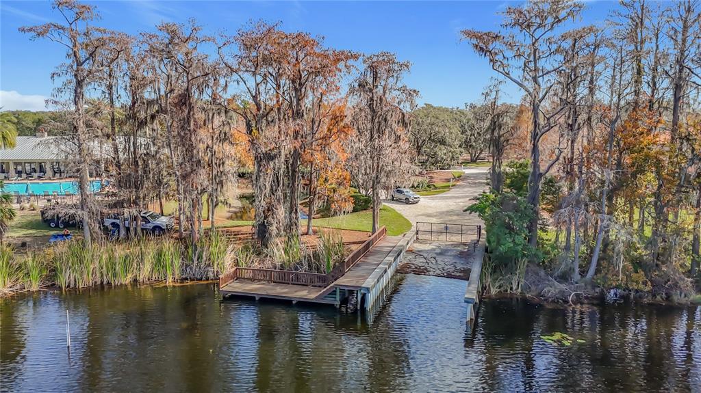 8942 Sandusky Lane New Port Richey, FL 34654 - Photo 87 of 87 a view of swimming pool with yard and lake view in back