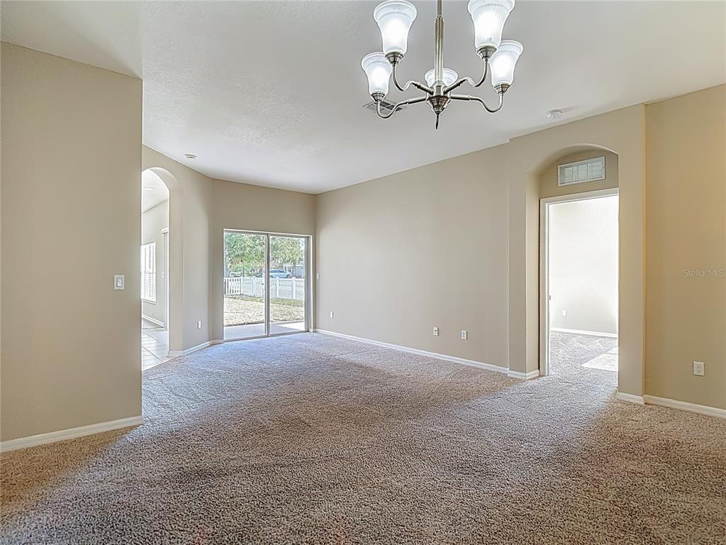 8942 Sandusky Lane New Port Richey, FL 34654 - Photo 9 of 87 a view of an empty room with a window