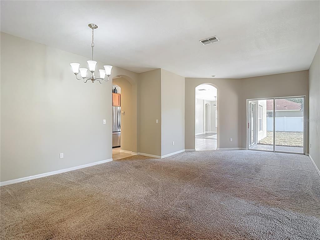 8942 Sandusky Lane New Port Richey, FL 34654 - Photo 10 of 87 a view of an empty room with a window