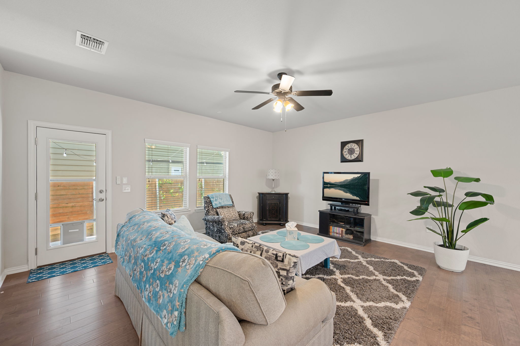 8800 Slater Drive Austin, TX 78747 - Photo 10 of 40 a living room with furniture a wooden floor and a window