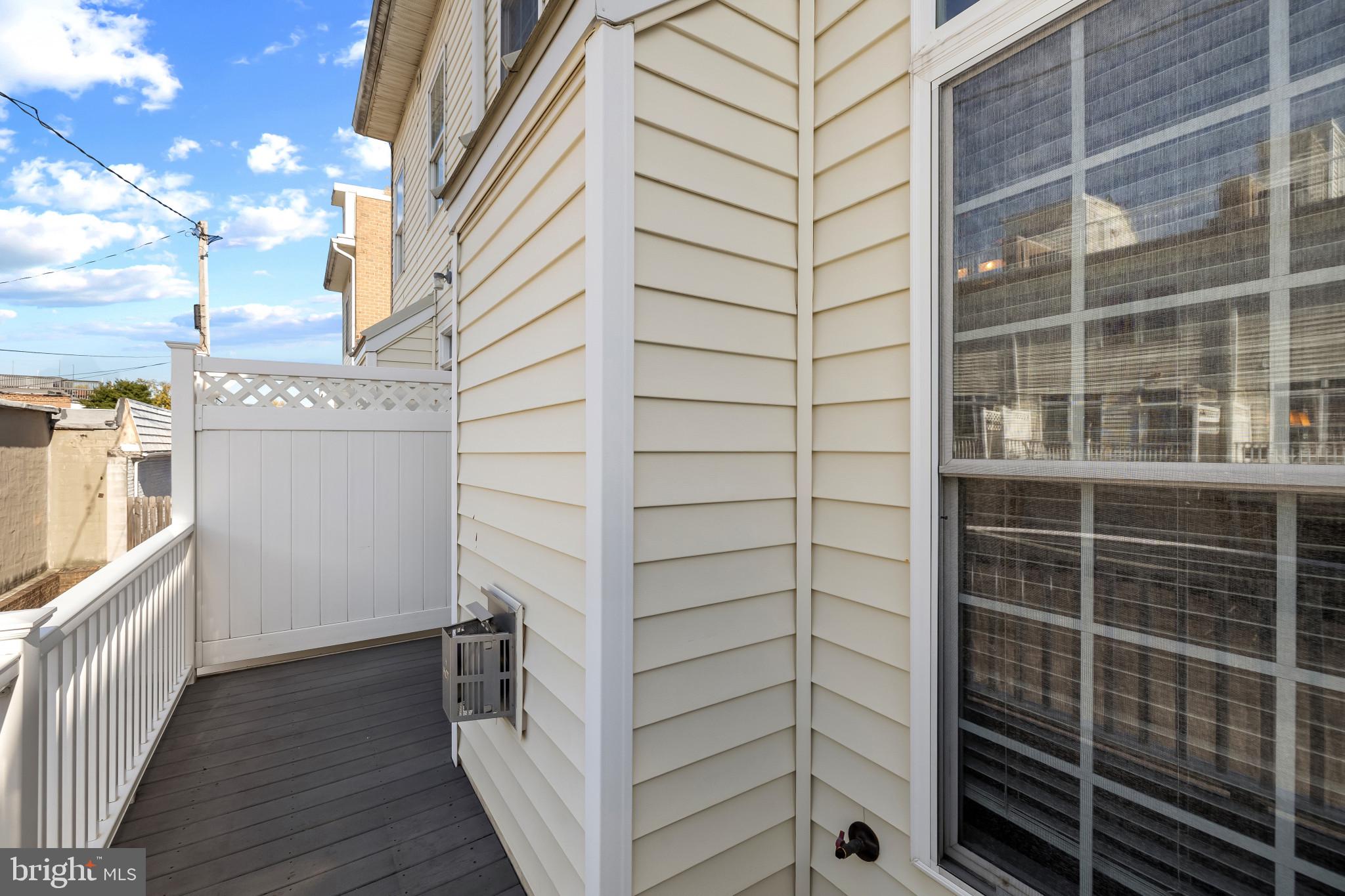 608 South Glover Street Baltimore, MD 21224 - Photo 21 of 41 Rear patio of living room