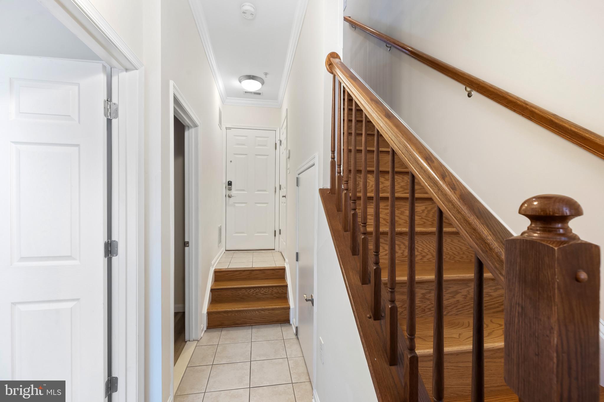 608 South Glover Street Baltimore, MD 21224 - Photo 8 of 41 Main level interior w/ stairs to second level