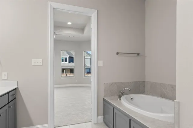 a bathroom with a bathtub and a shower