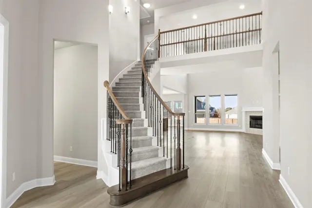 a view of entryway and hall with wooden floor