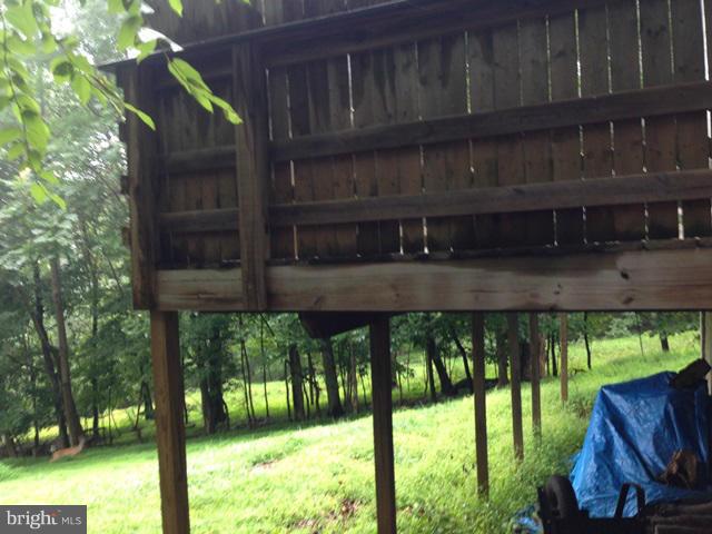 341 Luchase Road Linden, VA 22642 - Photo 12 of 30 a view of balcony with two plants and wooden fence