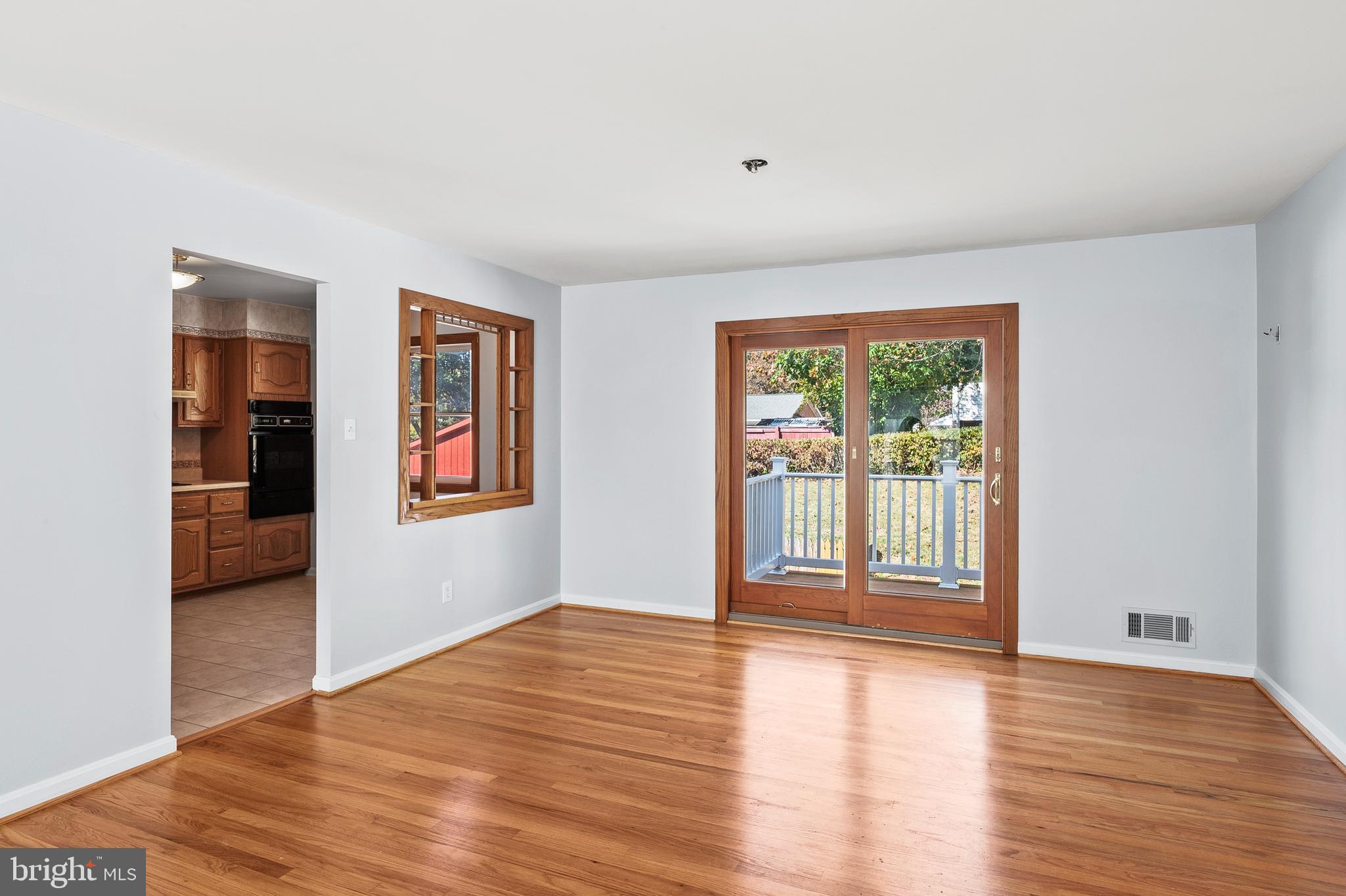 1904 Powder Mill Road Silver Spring, MD 20903 - Photo 8 of 43 a view of a big room with wooden floor and windows