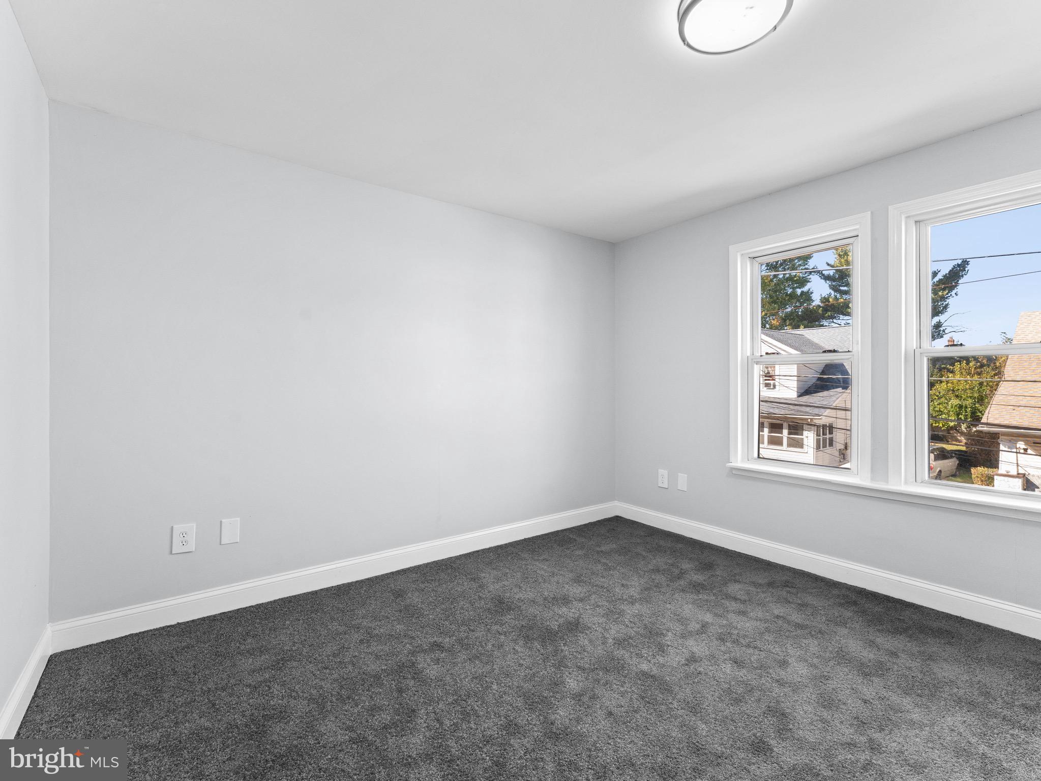 125 White Avenue Marcus Hook, PA 19061 - Photo 11 of 23 an empty room with windows