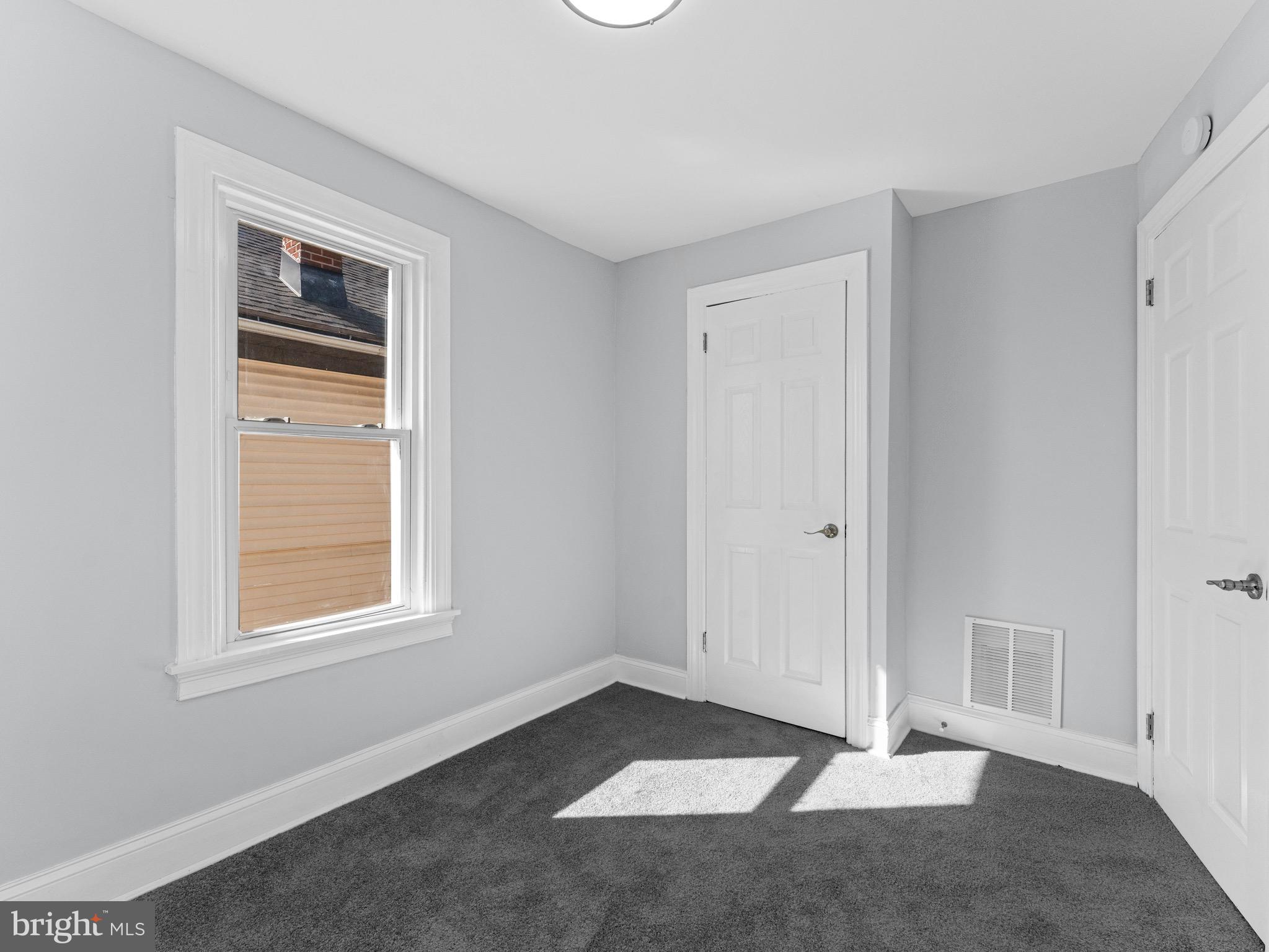 125 White Avenue Marcus Hook, PA 19061 - Photo 14 of 23 a view of an empty room with window