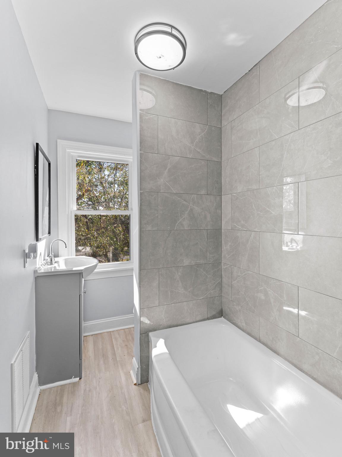 125 White Avenue Marcus Hook, PA 19061 - Photo 18 of 23 a bathroom with a bathtub and shower