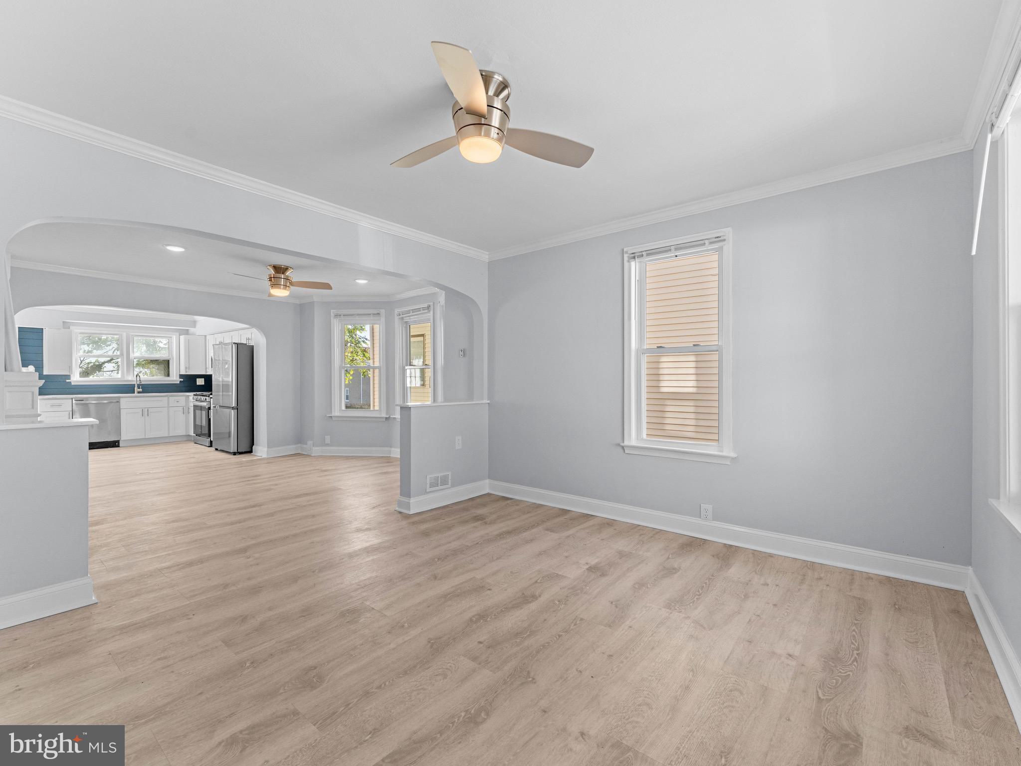 125 White Avenue Marcus Hook, PA 19061 - Photo 4 of 23 wooden floor in an empty room with a window