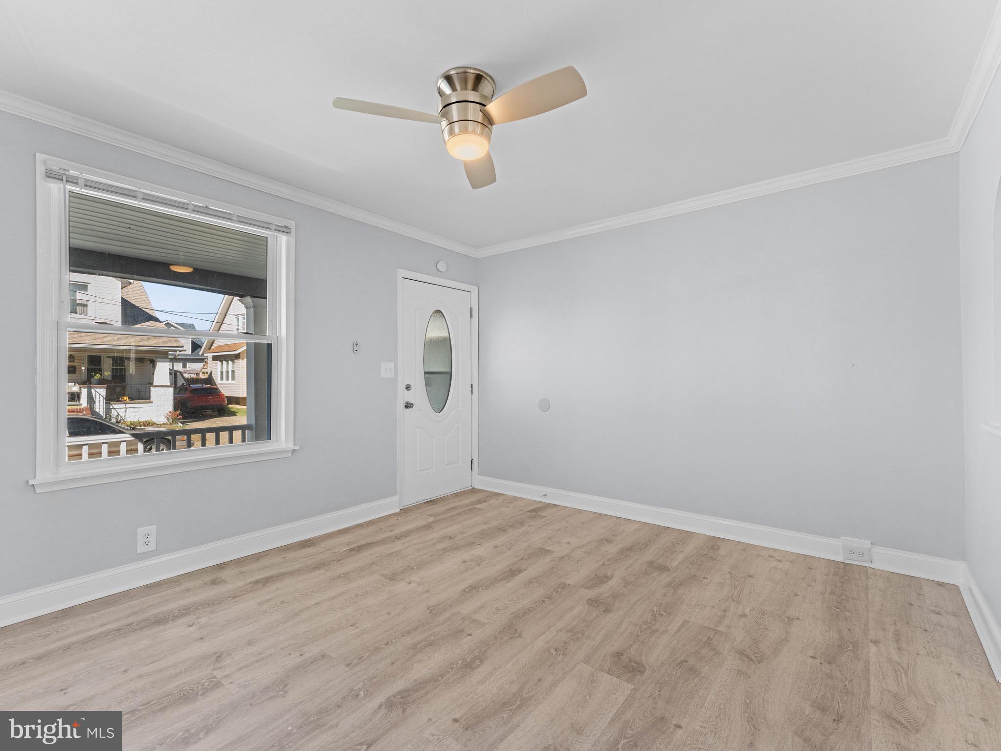 125 White Avenue Marcus Hook, PA 19061 - Photo 5 of 23 a view of an empty room with a window