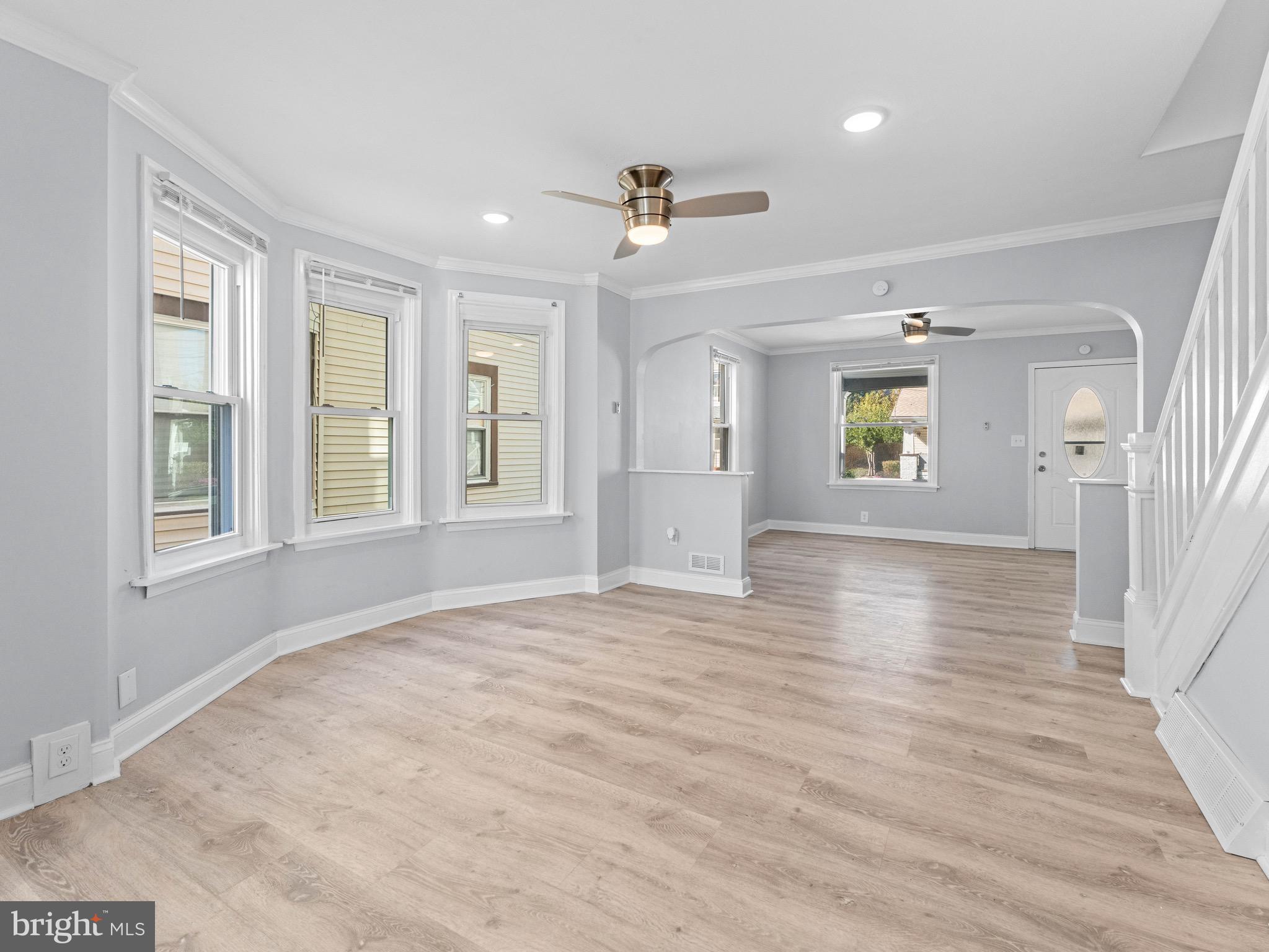 125 White Avenue Marcus Hook, PA 19061 - Photo 7 of 23 a view of an empty room with a window and wooden floor