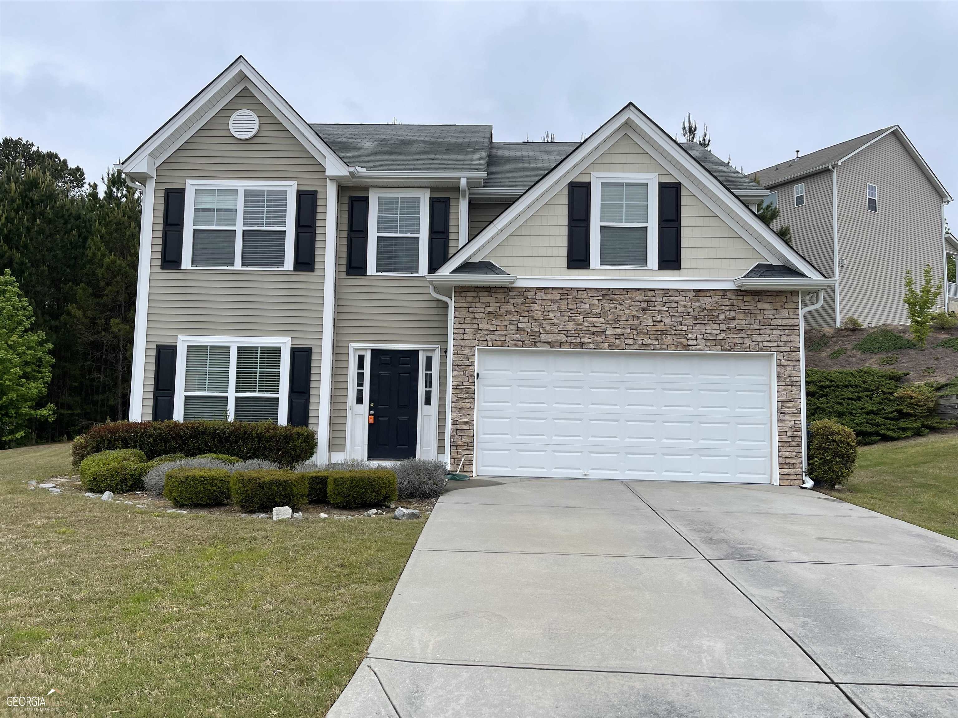 3904 Potomac Walk Court Loganville, GA 30052 - Photo 1 of 1 a front view of a house with a yard and garage