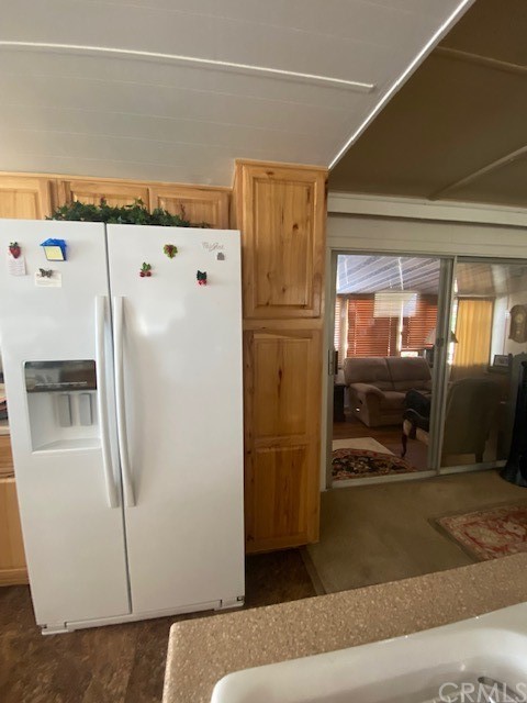 12874 California Street, Unit 48 Yucaipa, CA 92399 - Photo 11 of 21 a white refrigerator freezer and a dishwasher in a kitchen