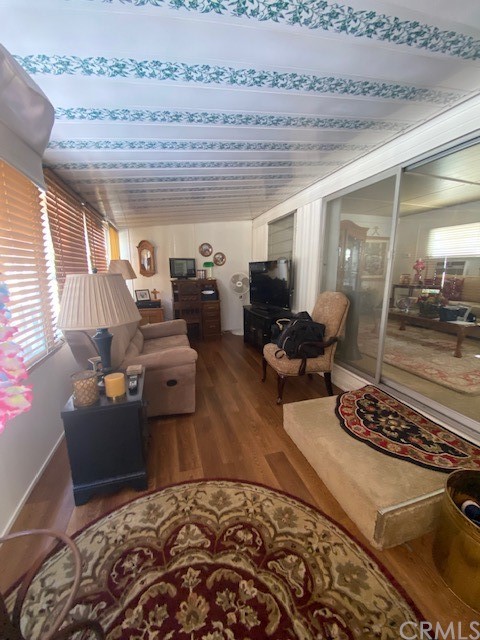 12874 California Street, Unit 48 Yucaipa, CA 92399 - Photo 14 of 21 a living room with furniture and a wooden floor