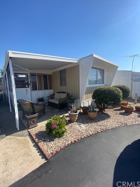 12874 California Street, Unit 48 Yucaipa, CA 92399 - Photo 15 of 21 a front view of a house with a patio