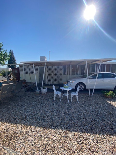 12874 California Street, Unit 48 Yucaipa, CA 92399 - Photo 17 of 21 a view of a backyard with furniture