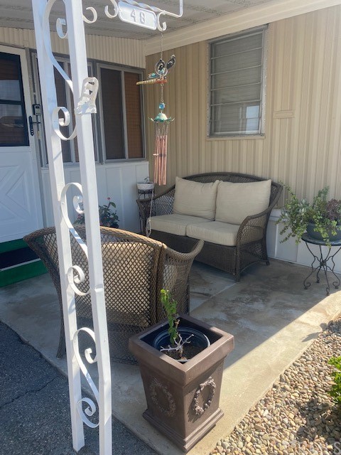 12874 California Street, Unit 48 Yucaipa, CA 92399 - Photo 19 of 21 a living room with furniture and a fireplace
