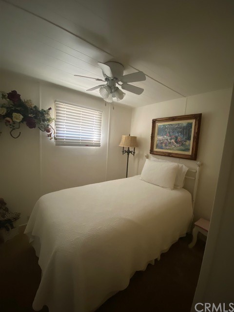 12874 California Street, Unit 48 Yucaipa, CA 92399 - Photo 3 of 21 a bedroom with a bed and a chandelier