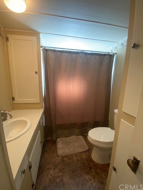 12874 California Street, Unit 48 Yucaipa, CA 92399 - Photo 5 of 21 a bathroom with a granite countertop sink toilet and shower